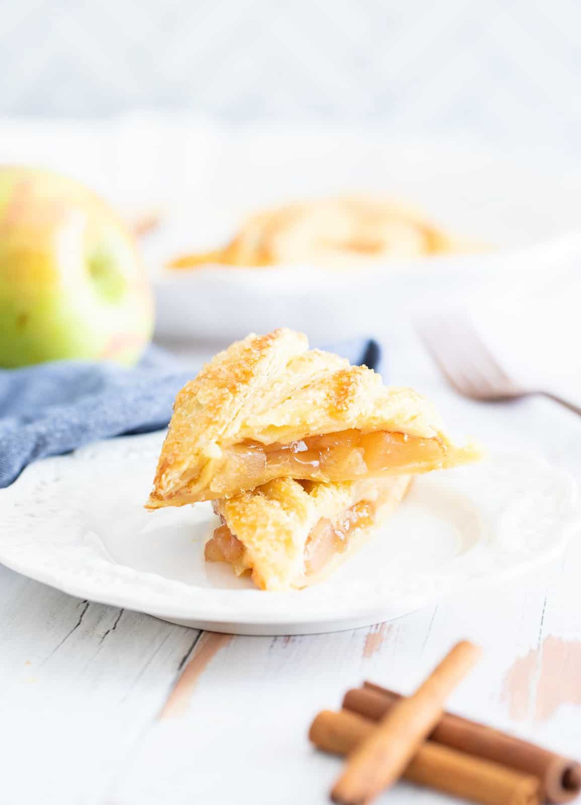 Two stacked triangles of pastry on plate