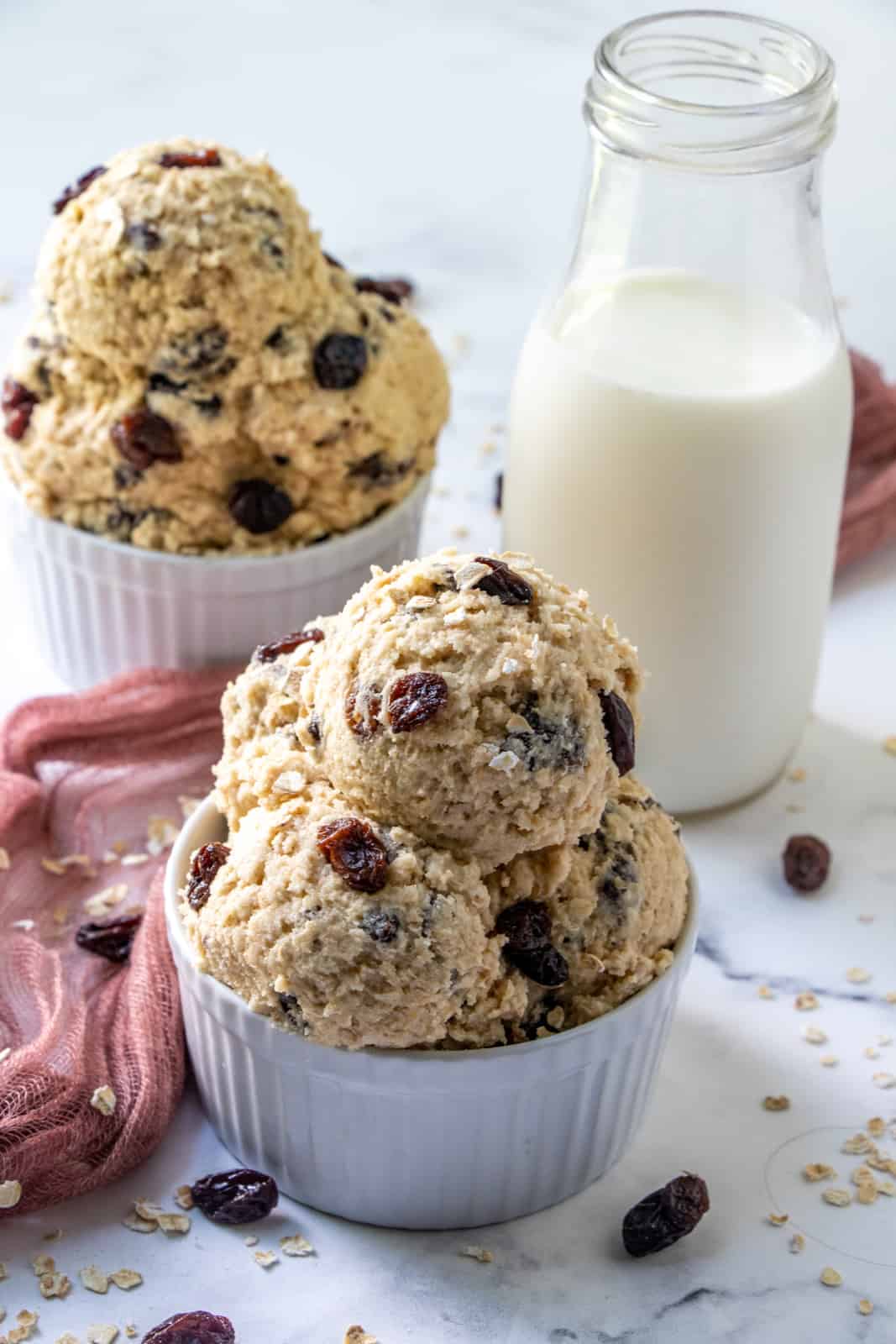 Edible Cookie Dough in two containers with milk and raisins
