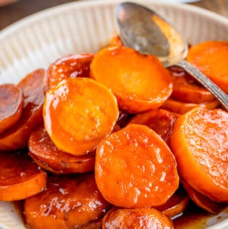 Bowl of Candied Sweet Potatoes with spoon