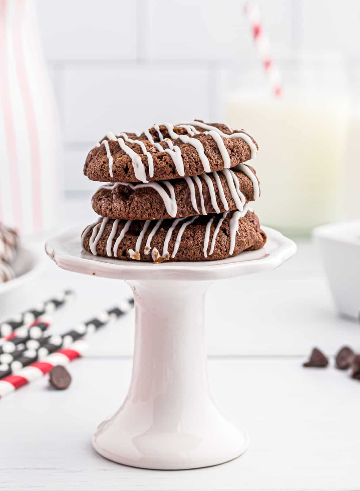Three Chocolate Chocolate Chip Cookies stacked on pedestal 