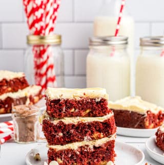 Three stacked Red Velvet Brownies on white plate