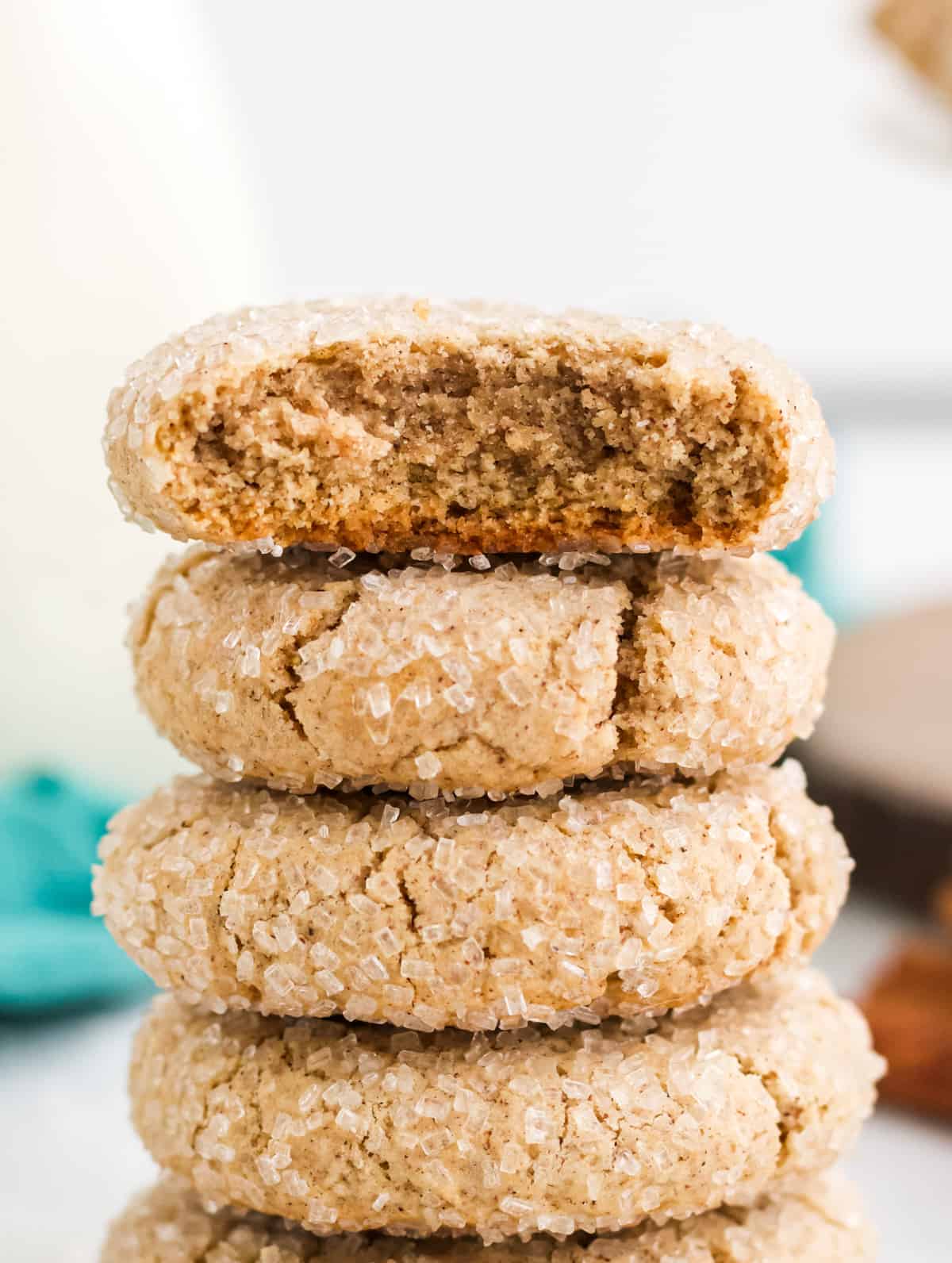 Close up of stacked cookies with one with bite taken out