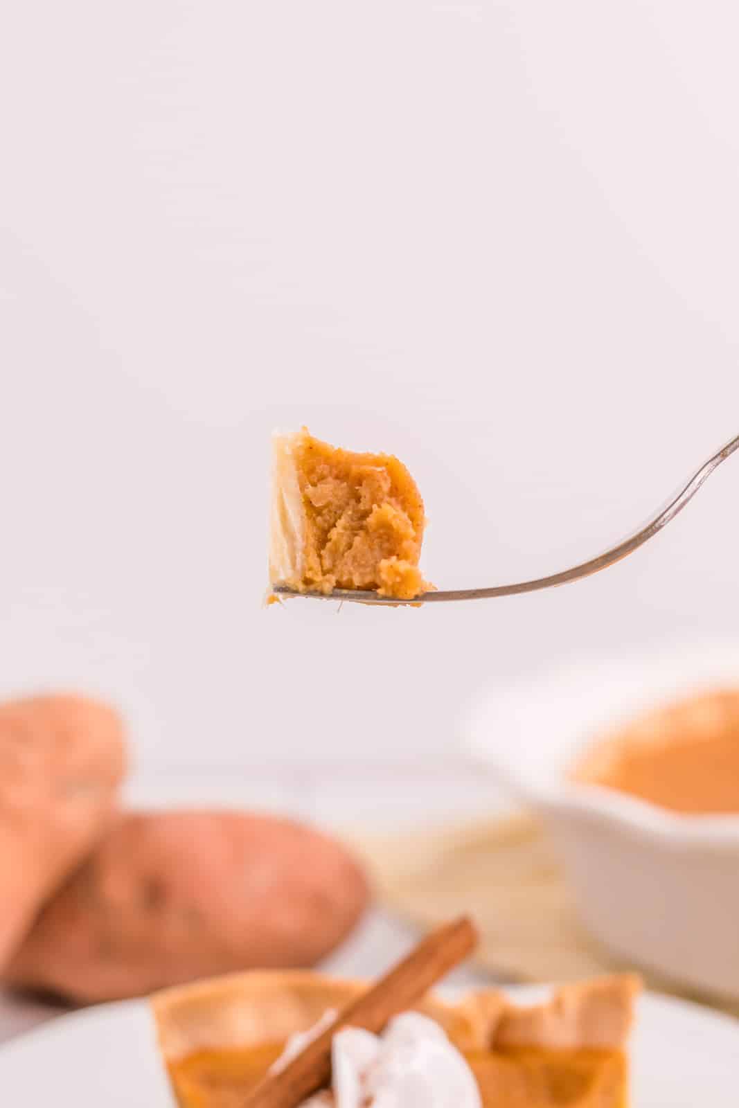 Fork with piece of Sweet Potato Pie on fork