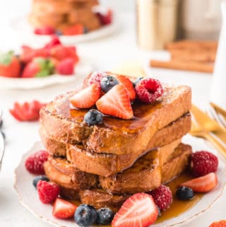 Stack of French Toast With berries and syrup