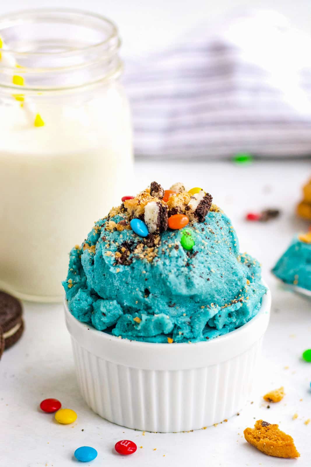 Ramekin full of Cookie Monster Edible Cookie Dough topped with chopped cookies 