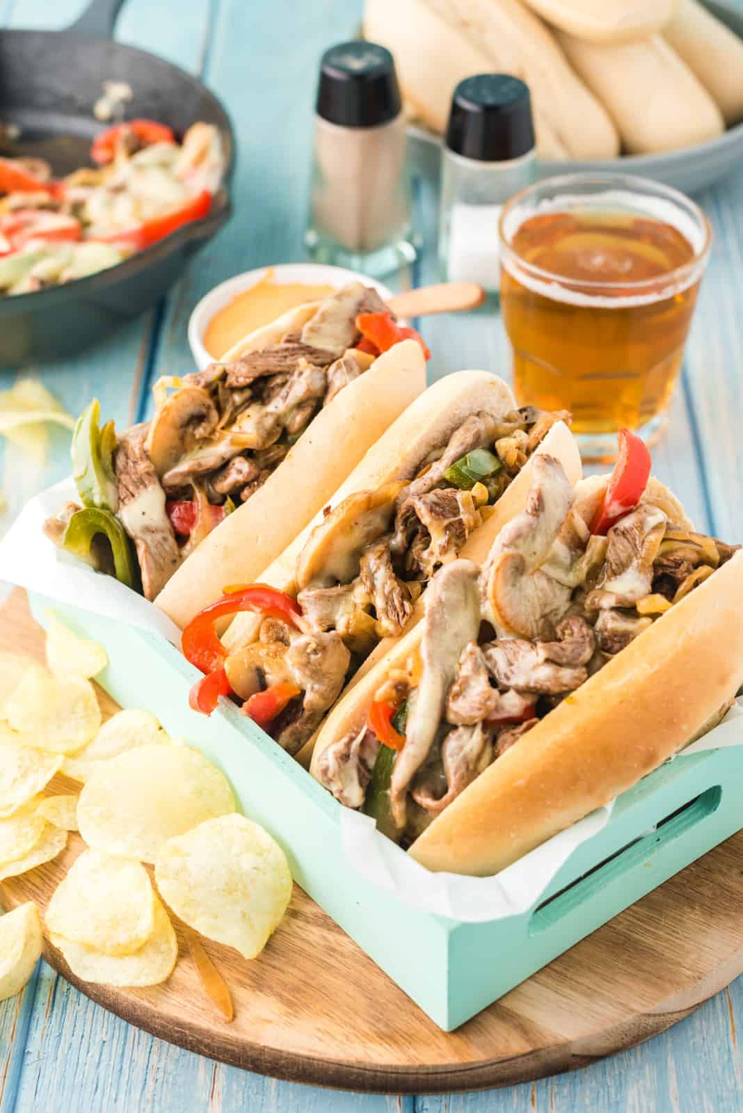 Philly Cheesesteak Recipe in tray with potato chips on side