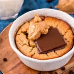 White bowl with Baked Oats topped with peanut butter and chocolate square image