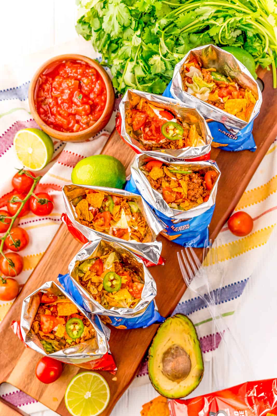 Overhead of Walking Tacos assembled on wooden board