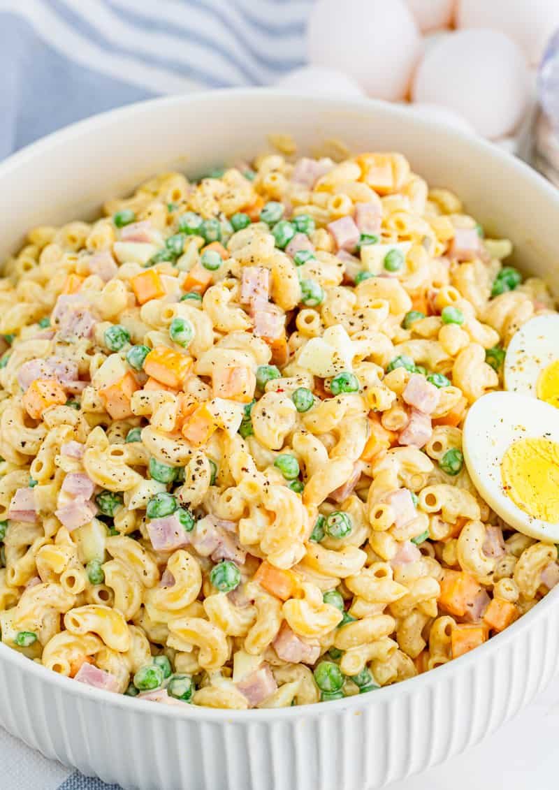 Macaroni Salad Recipe in large serving dish with halve hard-boiled egg