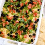 Square image overhead of 7 Layer Dip with chips on side