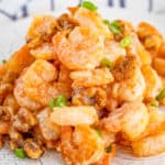 Square close up image of piled shrimp on plate