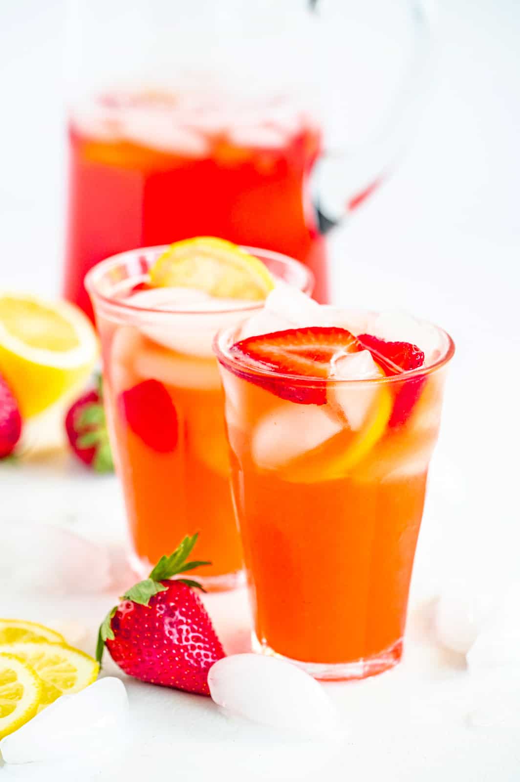 Strawberry Lemonade Recipe in glasses with pitcher in background