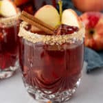 Square photos of glass of Apple Cider Sangria with garnishes.