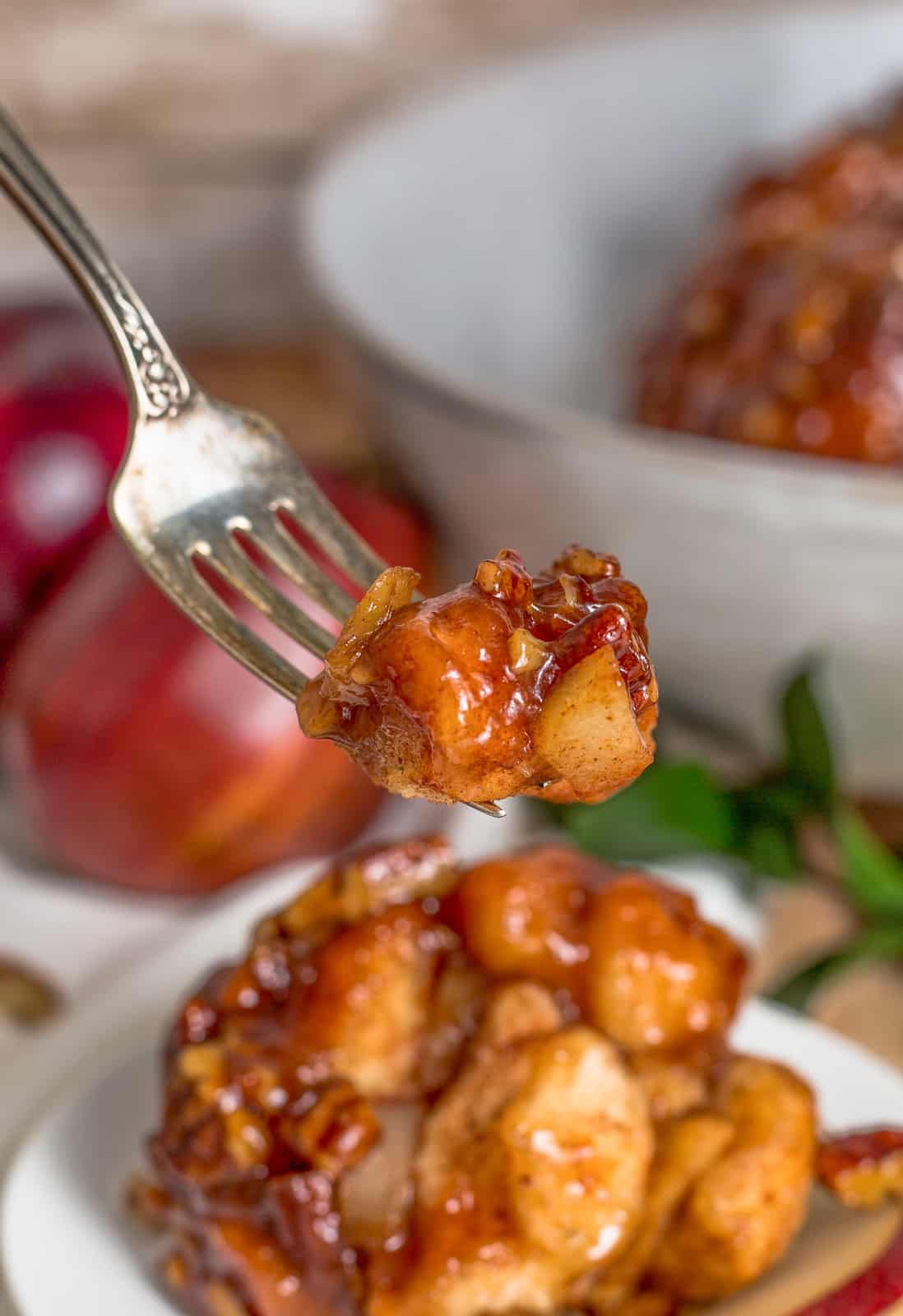 Fork holding up a bite of Apple Monkey Bread Recipe