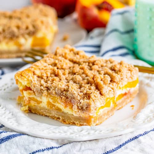 Peach Cobbler Cheesecake Bars - Tornadough Alli