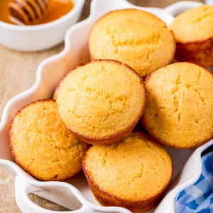 Squarre photo of Cornbread Muffins in white dish.