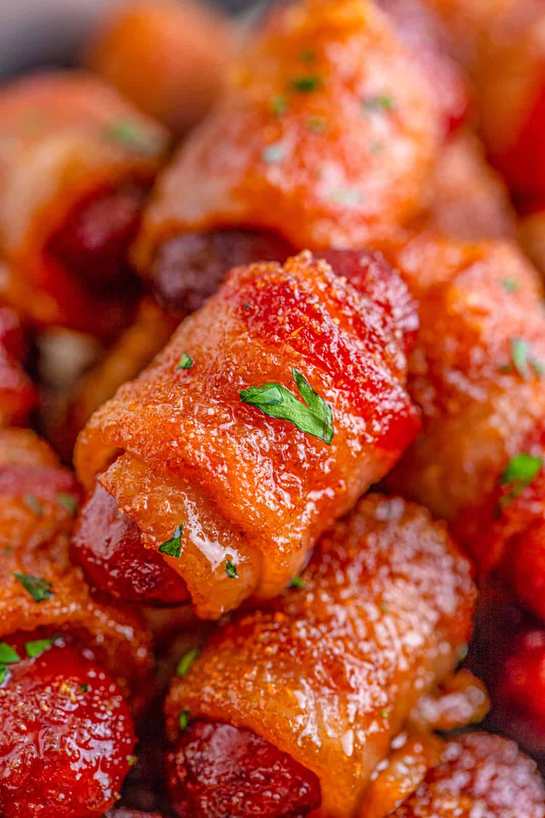 Close up of finished Brown Sugar Bacon Little Smokies with parsley.