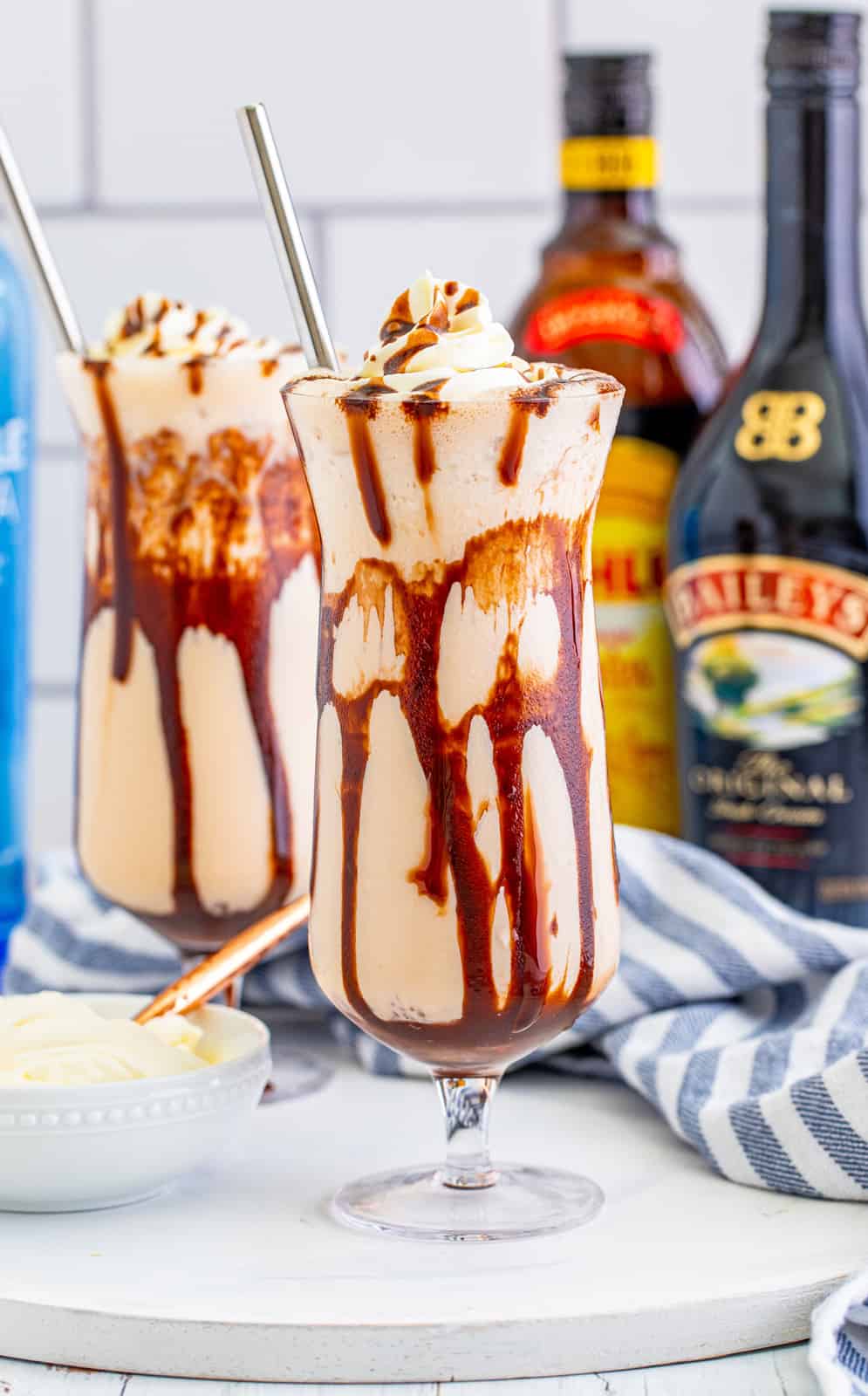 Straight on photo of Frozen Mudslide Recipe with alcohol in back.