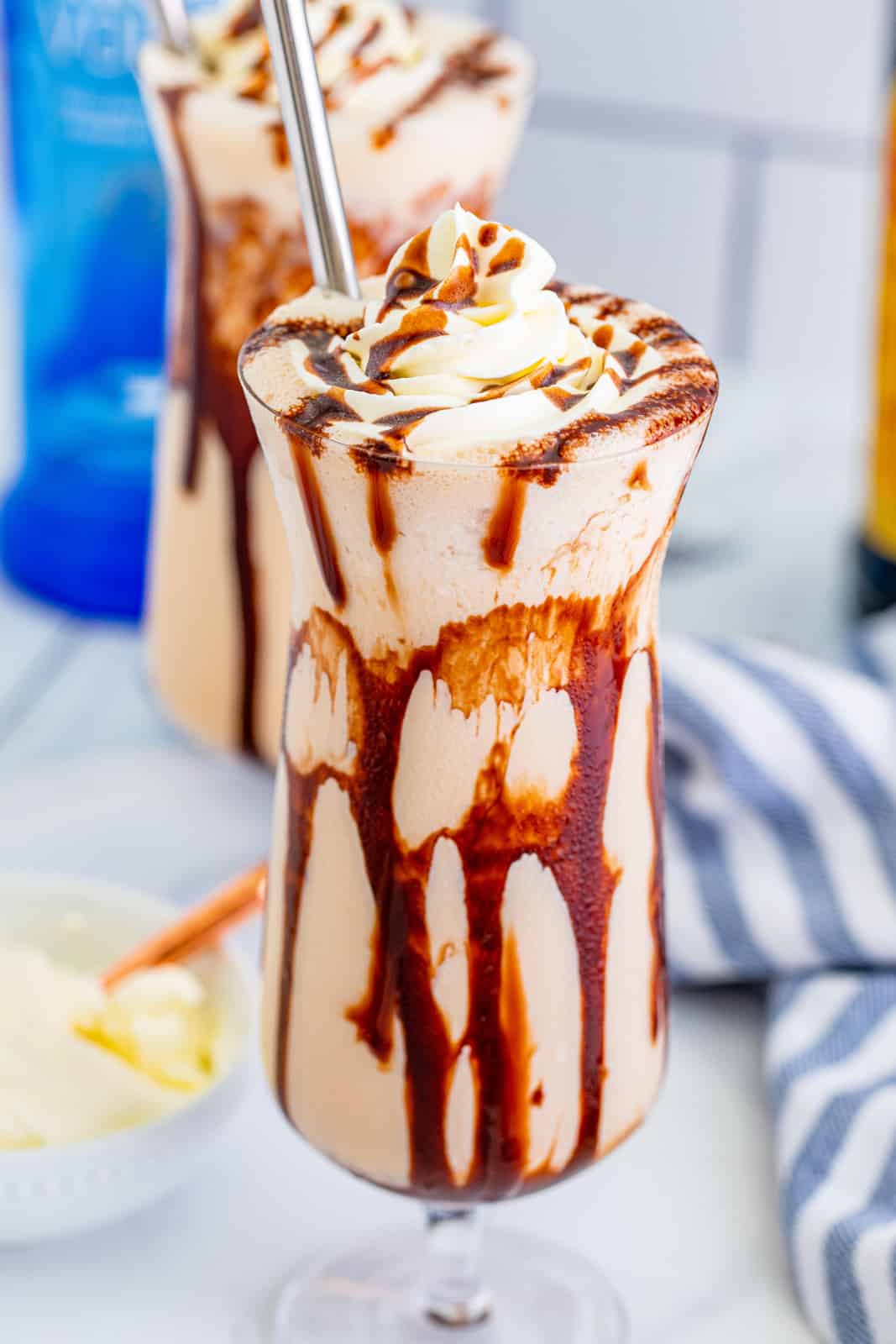 Close up of one Frozen Mudslide Recipe in glass with chocolate drizzle.