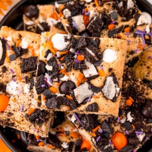 Square photo overhead of stacked Halloween Cookie Bars.
