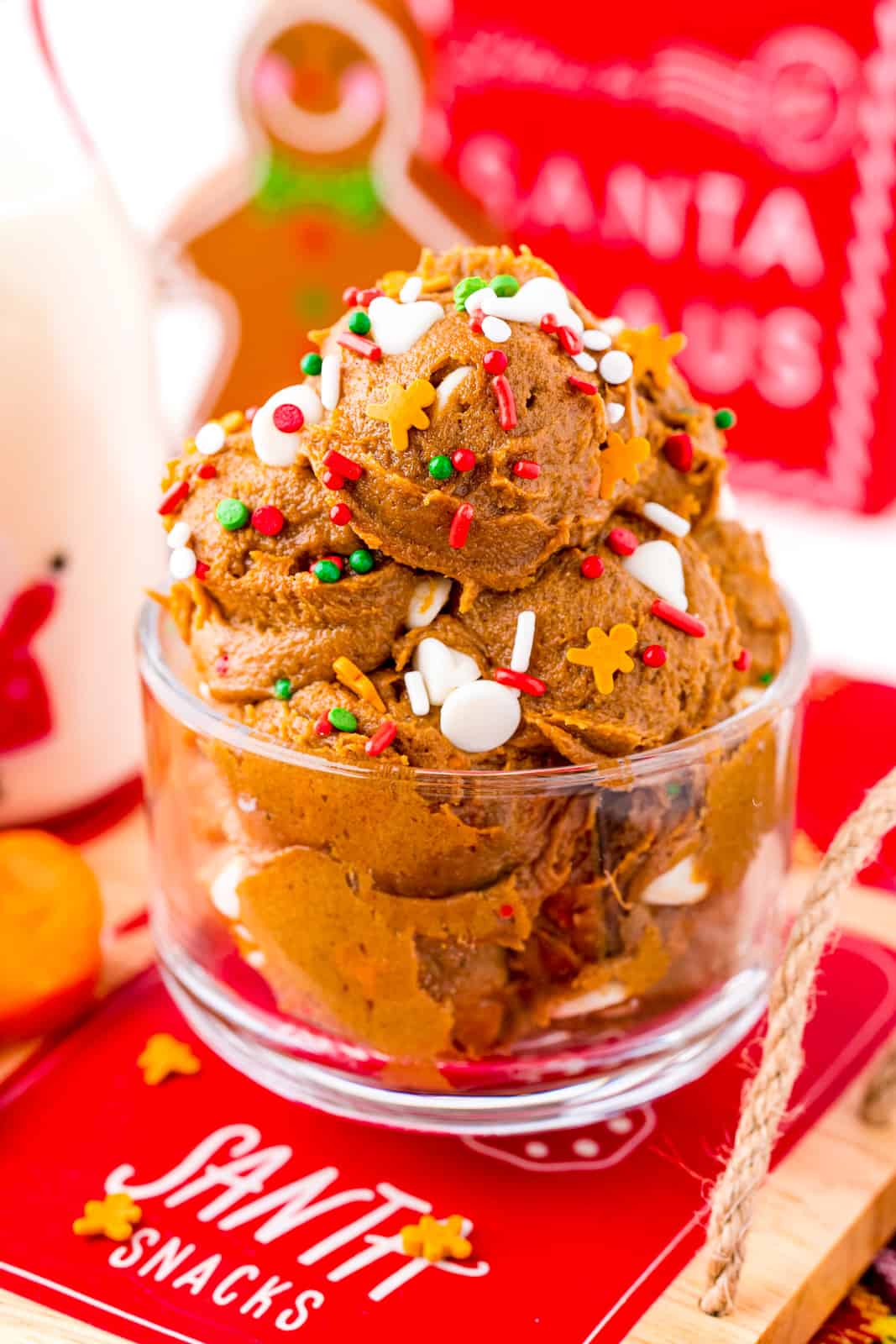 Gingerbread Edible Cookie Dough Recipe in glass dish with sprinkles and white chocolate chips.
