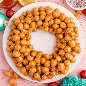 Square image of Struffoli in a decorated wreath.