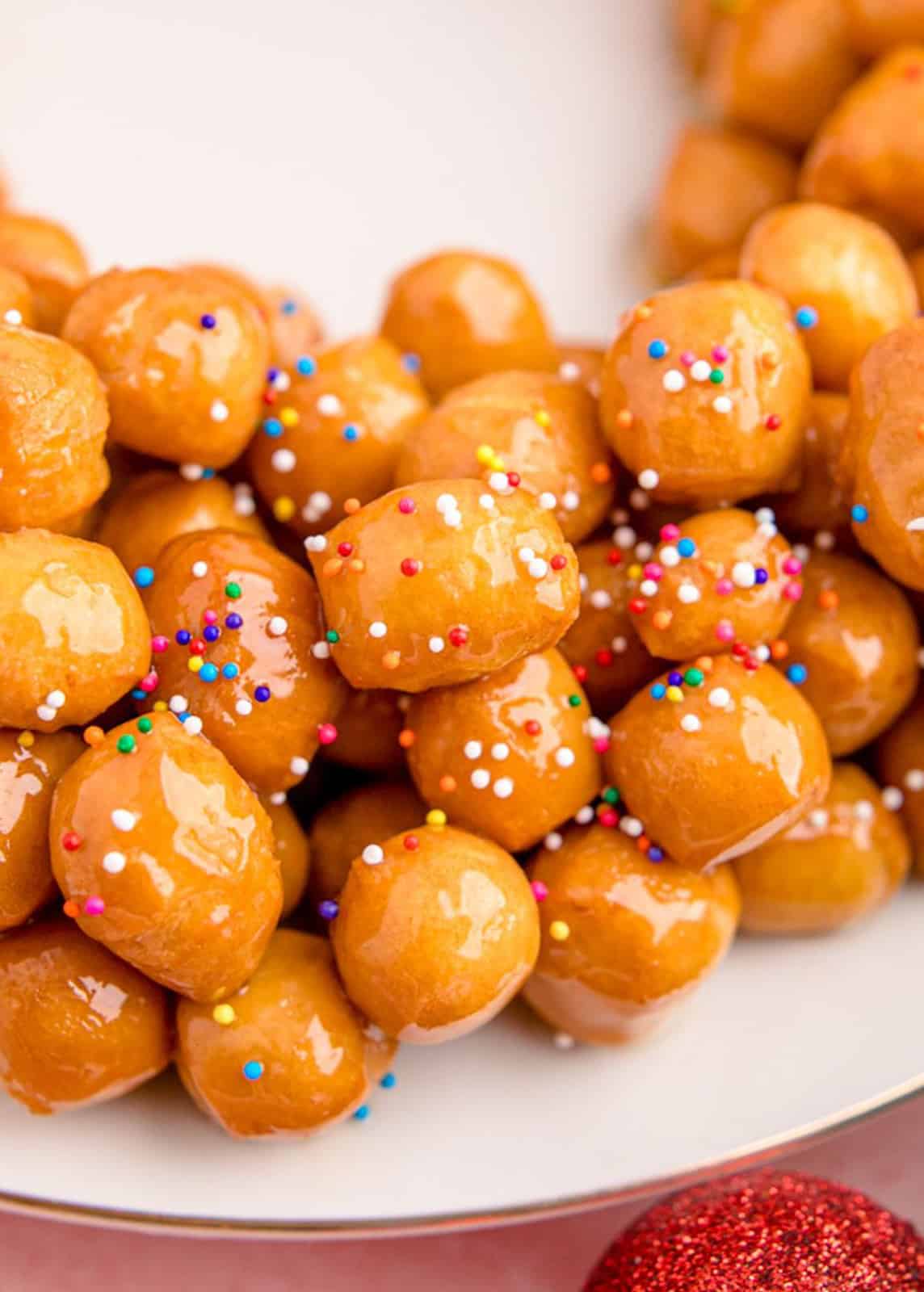 Close up of Struffoli showing the coated balls and sprinkles.