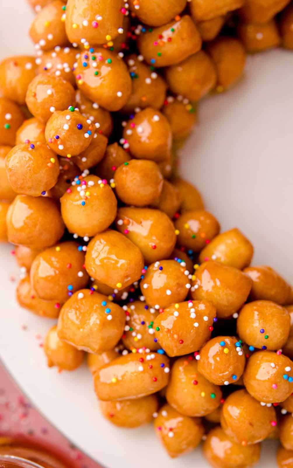 Overhead close up of side of recipe showing coated balls and sprinkles.