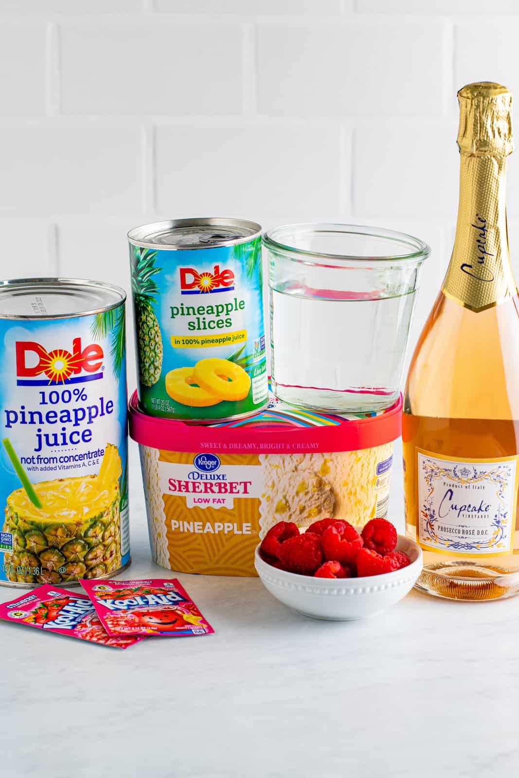 Ingredients needed to make Boozy Pineapple Punch.