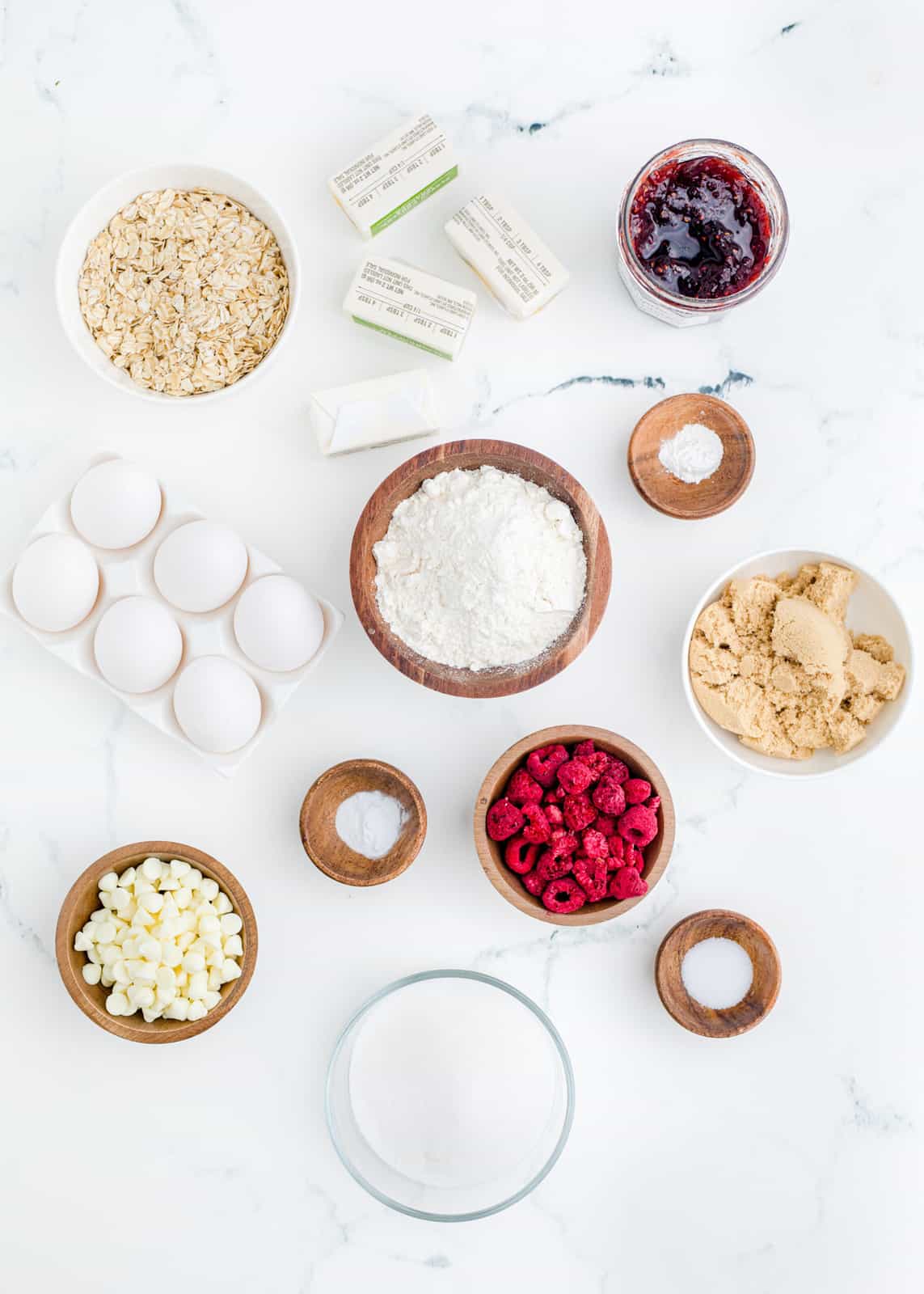Ingredients needed to make Raspberry Oatmeal White Chocolate Cookies.