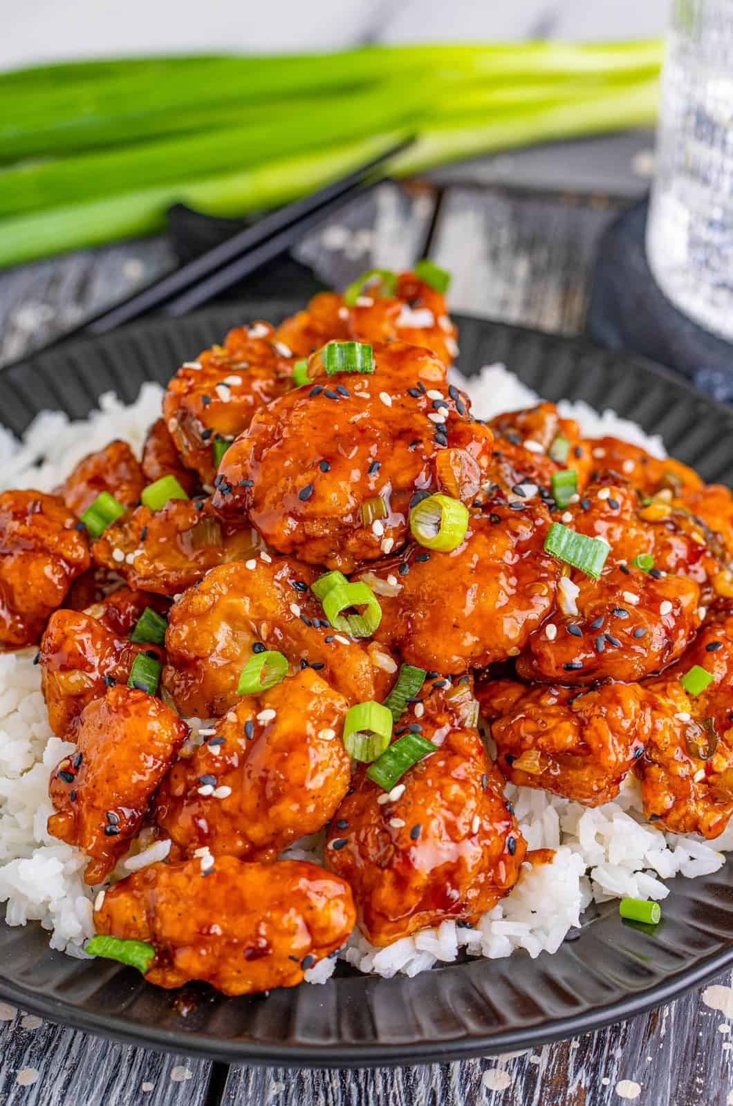 Sesame Chicken Recipe over a bed of rice.