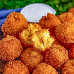 Square image of one split open Fried Mac and Cheese Ball.