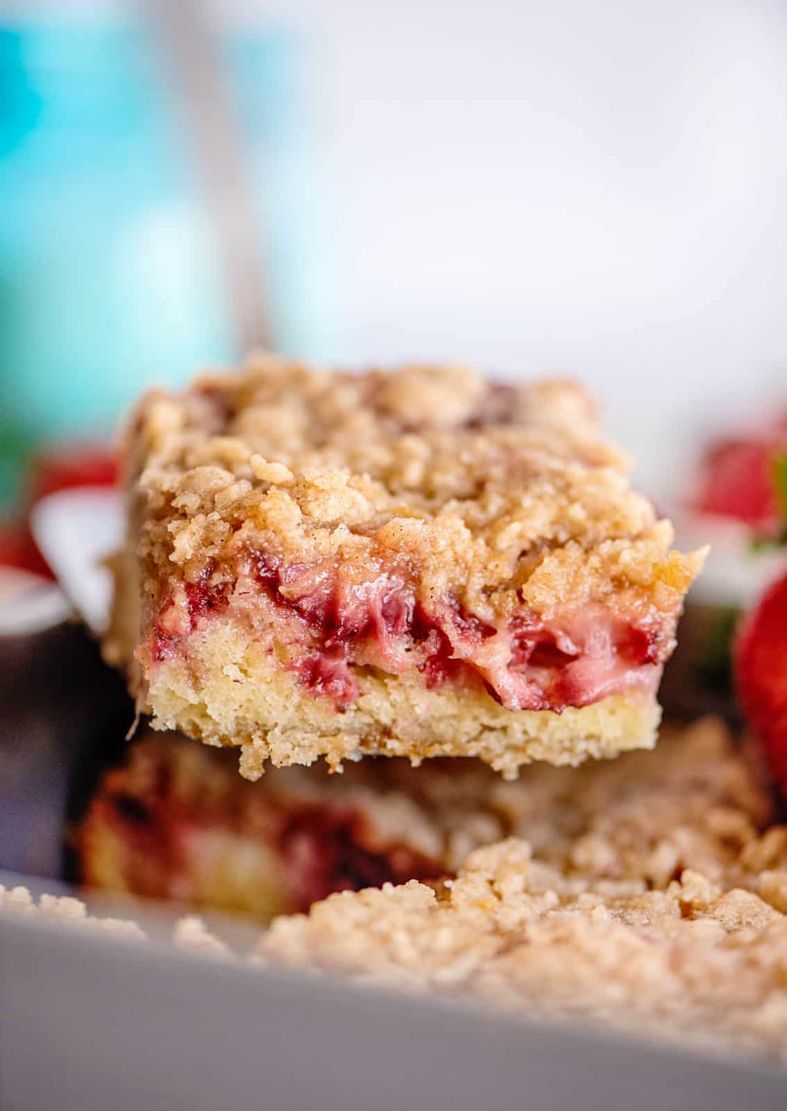 Slice of Strawberry Coffee Cake lifted up out of baking pan.