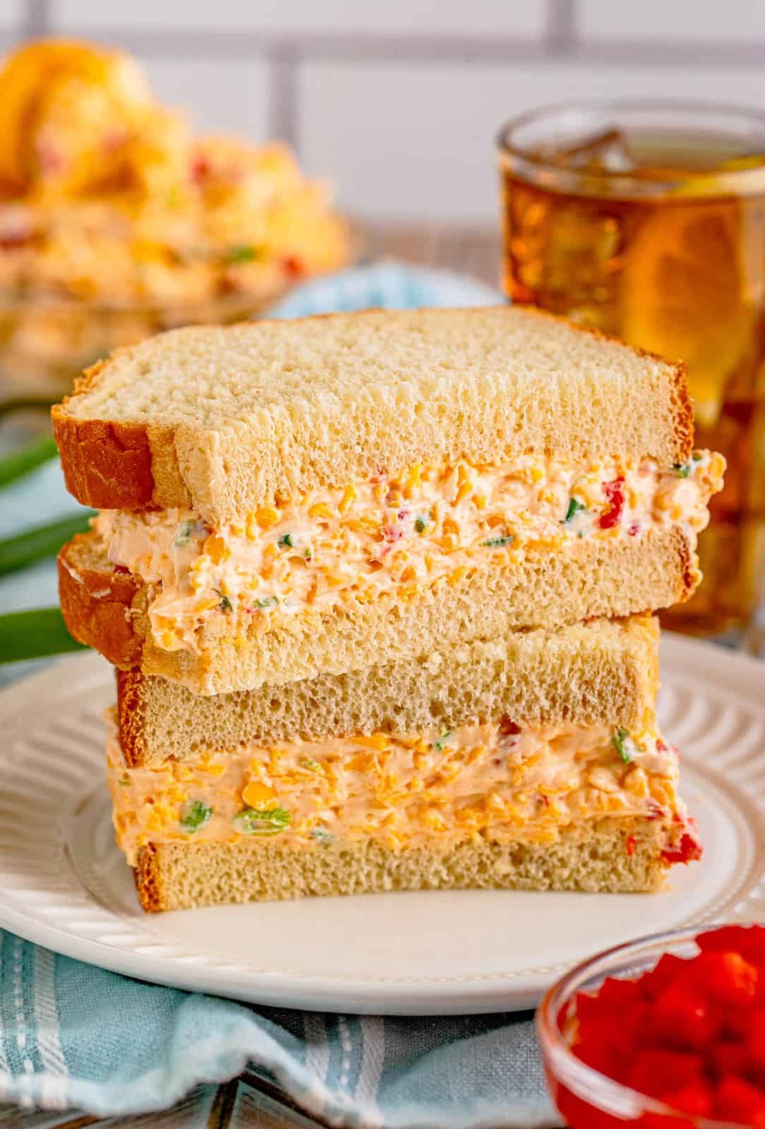 Stacked Pimento Cheese on sandwich split in half.