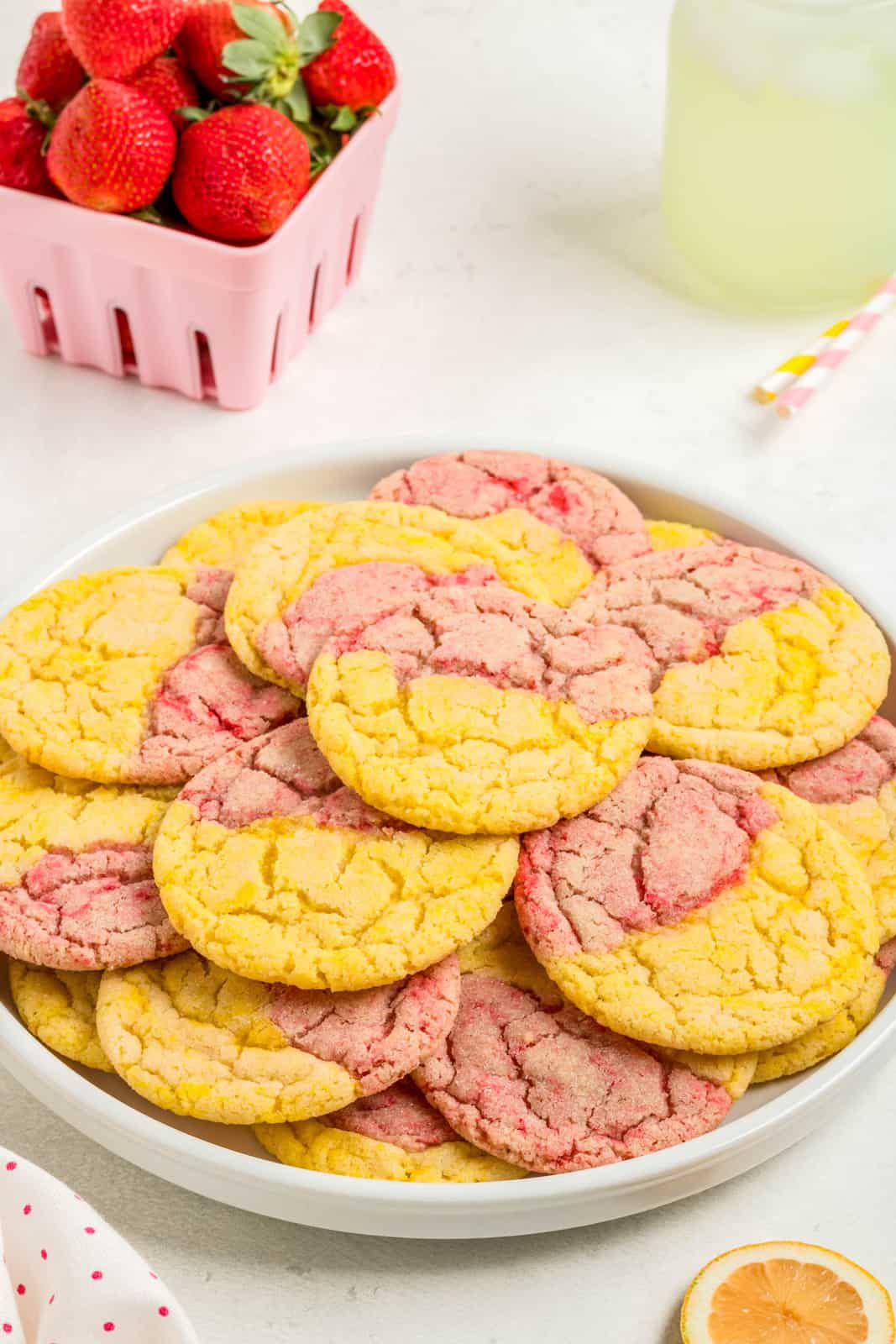 Stacked Strawberry Lemonade Cookies on round plate.