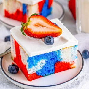 Square image of Tie Dye 4th of July Cake on white plate.