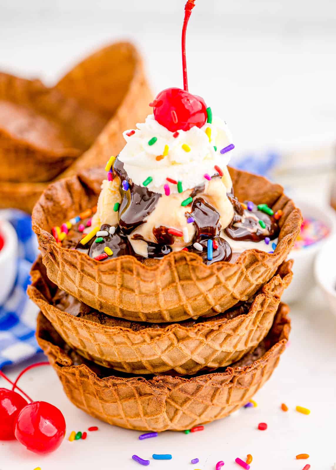 Stacked Brownie Sundae Bowls with top one with toppings.