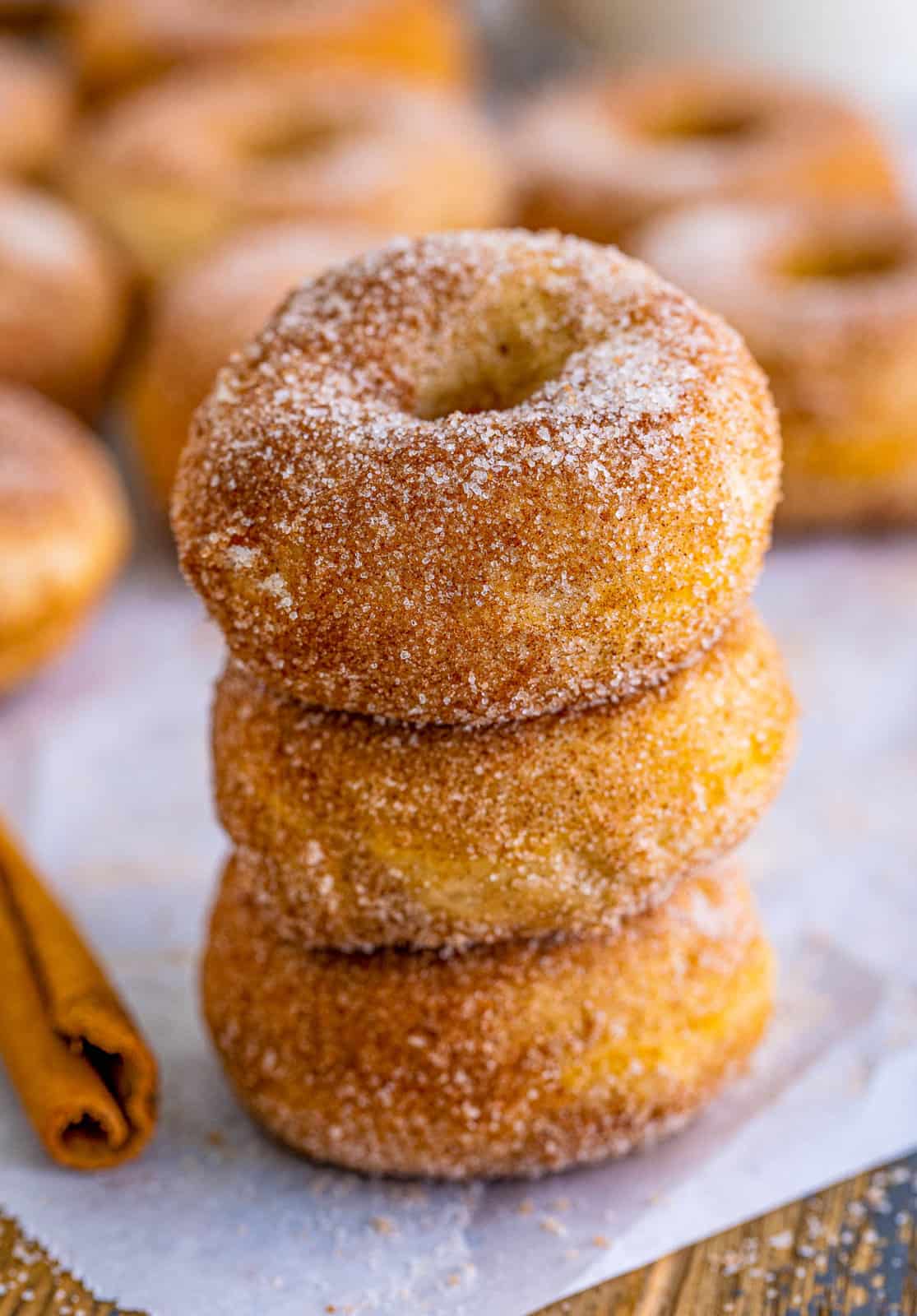 Three stacked Cinnamon Sugar Mini Donuts.