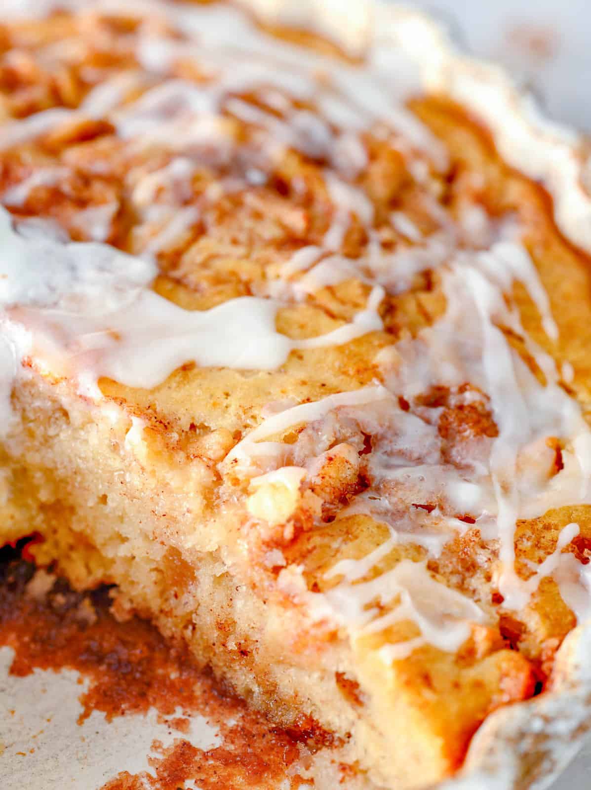 Close up of Apple Cinnamon Cake with slice taken out.