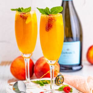 Square image of Bellinis in two glasses.