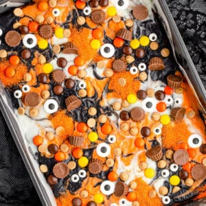 Square image of decorated brownies in pan.
