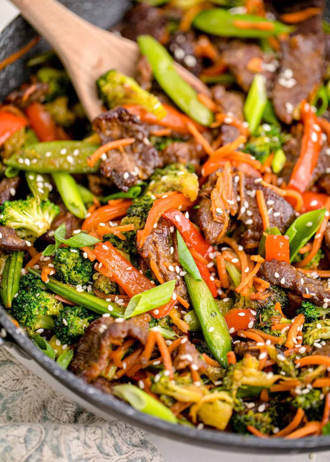 Close up of stir fry in pan showing all ingredients.