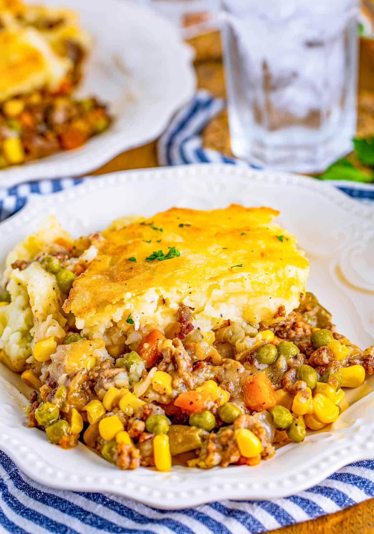 Easy Shepherd's Pie on white plate topped with parsley.