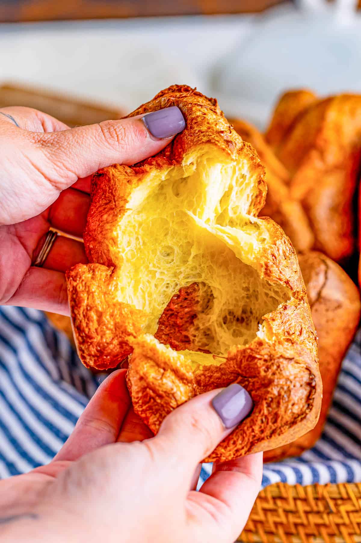 Hand opening up one of the popover recipes.