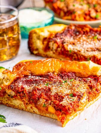 Close up square image of a slice of pizza.