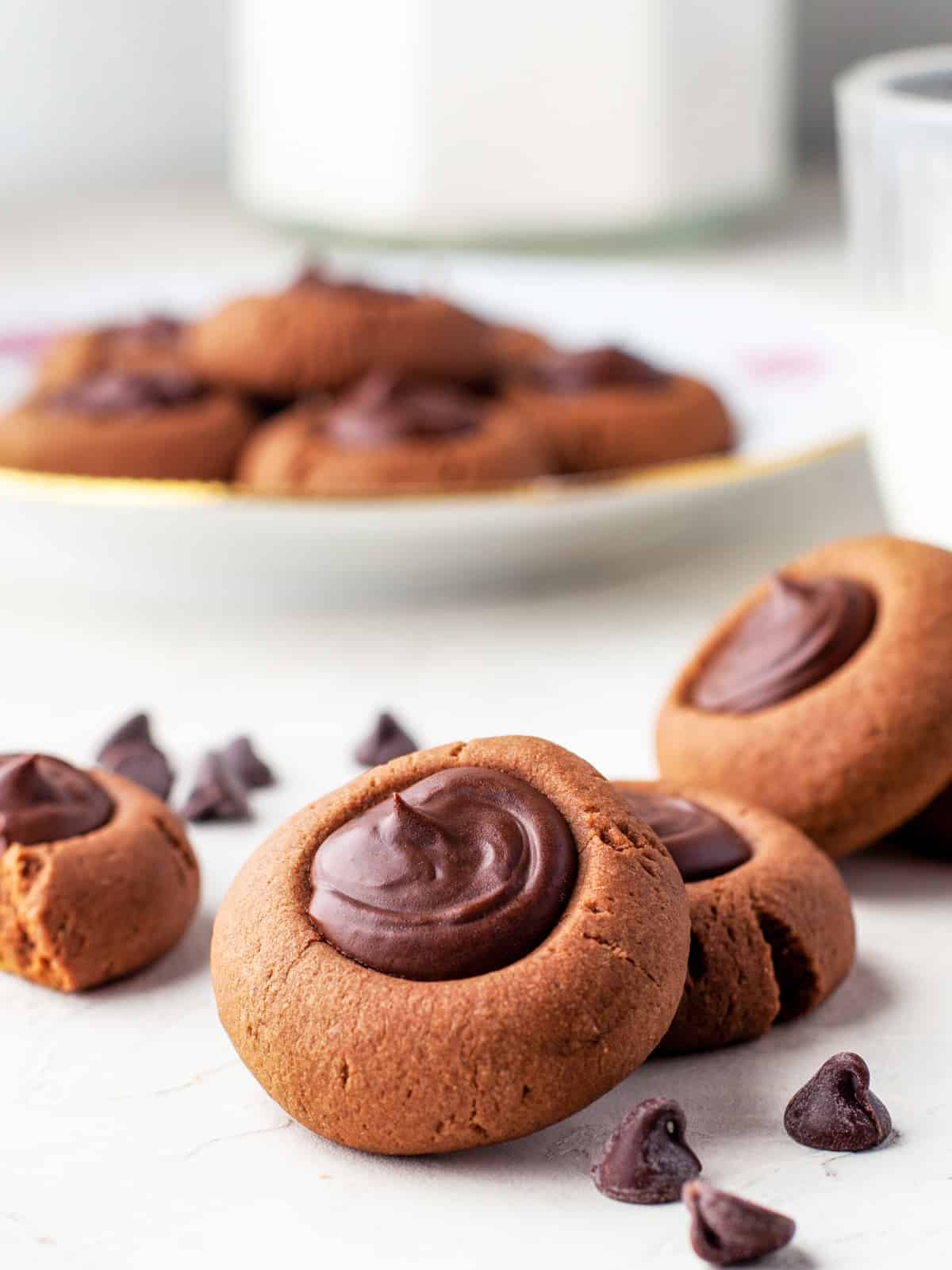 Two Chocolate Thumbprint Cookies layered against one another.
