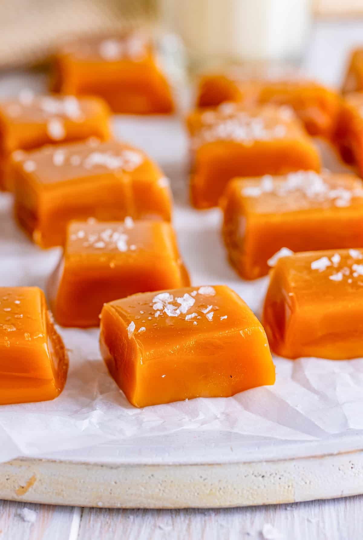 Cut and salted Homemade Caramels on parchment paper.