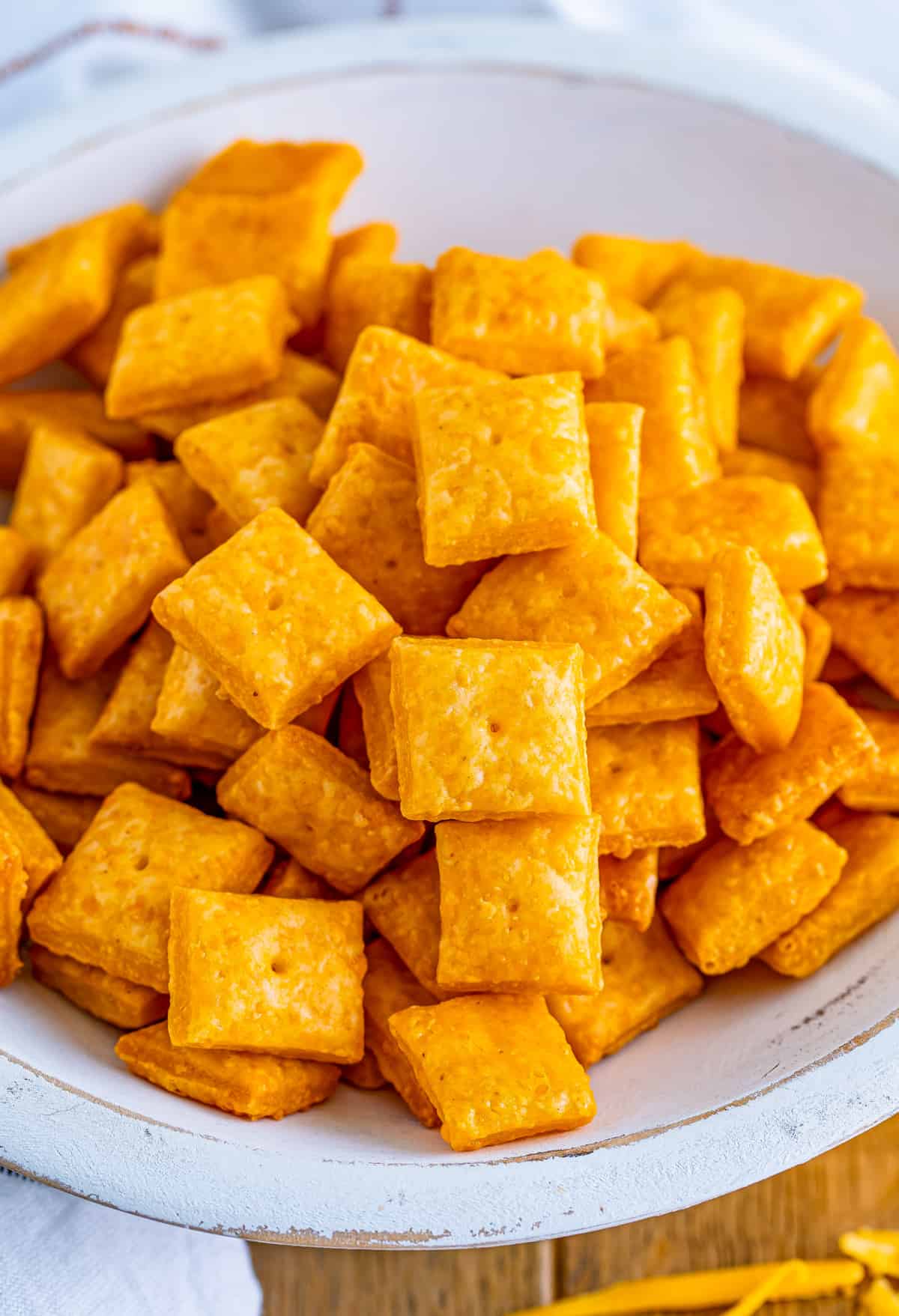 Overhead of Homemade Cheez-Its in white bowl.