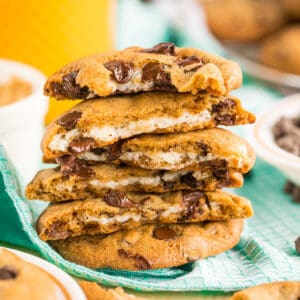 Square image of stacked cookies broken in half showing insides.