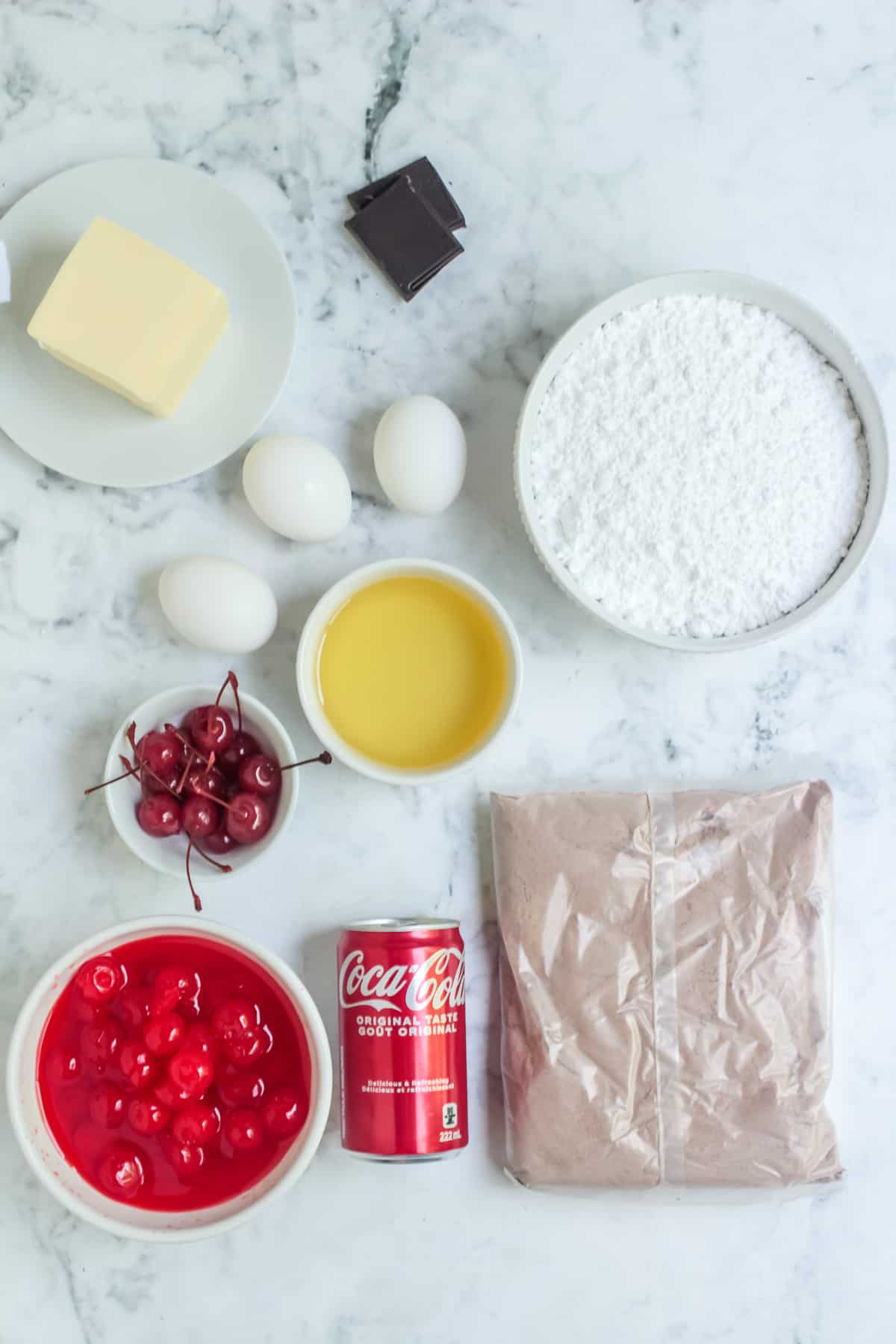 Ingredients needed to make Cherry Coke Cupcakes.